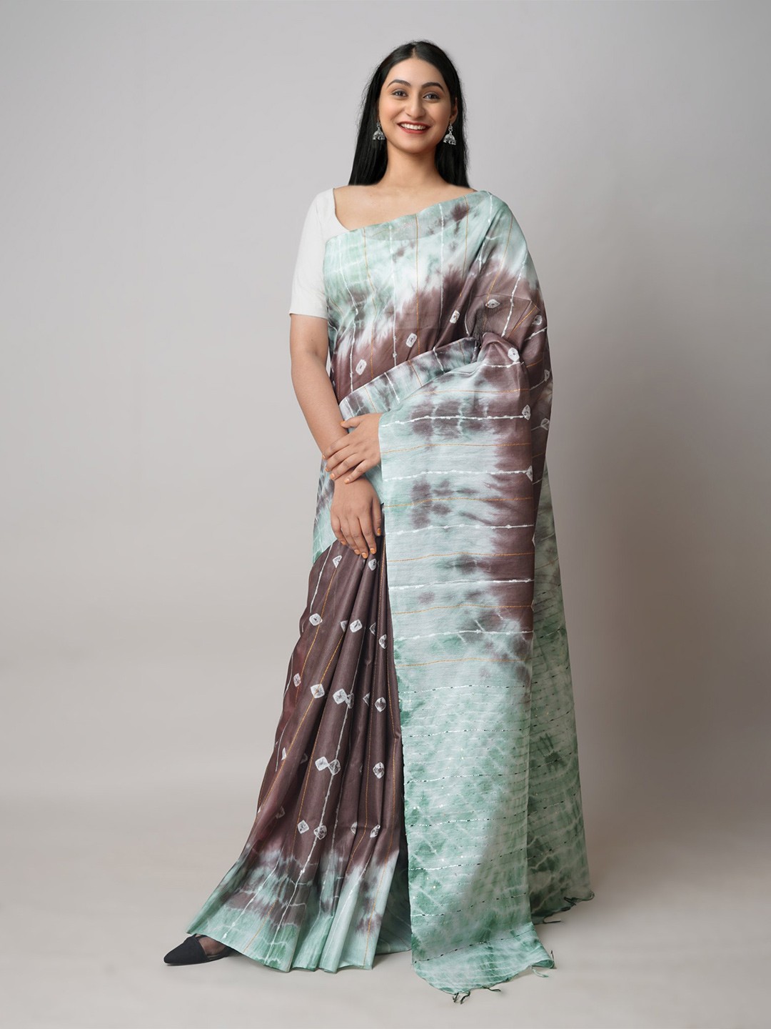 

Unnati Silks Brown & Green Tie and Dye Sequinned Silk Cotton Leheriya Saree