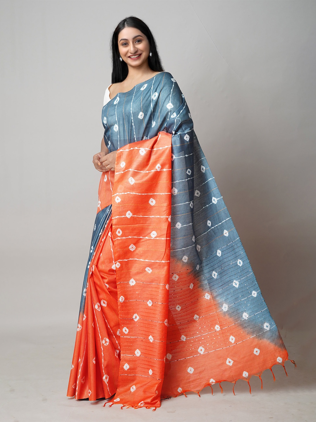 

Unnati Silks Orange & Grey Tie and Dye Sequinned Silk Cotton Leheriya Saree