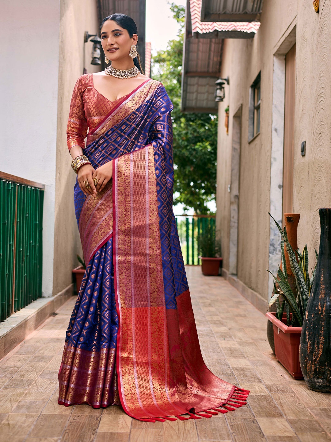 

Mitera Blue & Red Woven Design Zari Silk Blend Kanjeevaram Saree