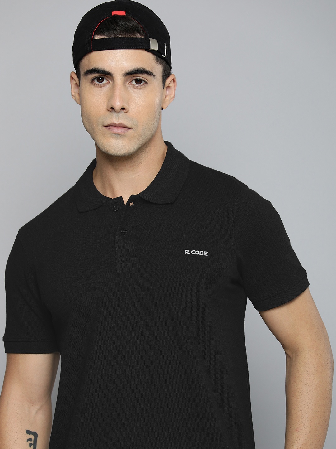 

R.Code by The Roadster Life Co. Men Solid Polo Collar T-shirt, Black