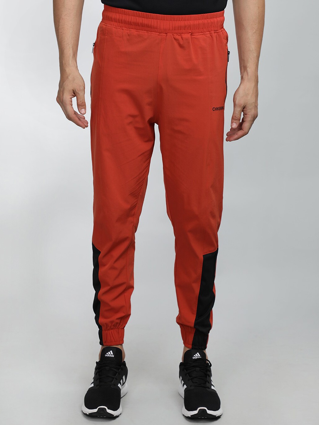 

CHKOKKO Men Colourblocked Sports Joggers, Orange