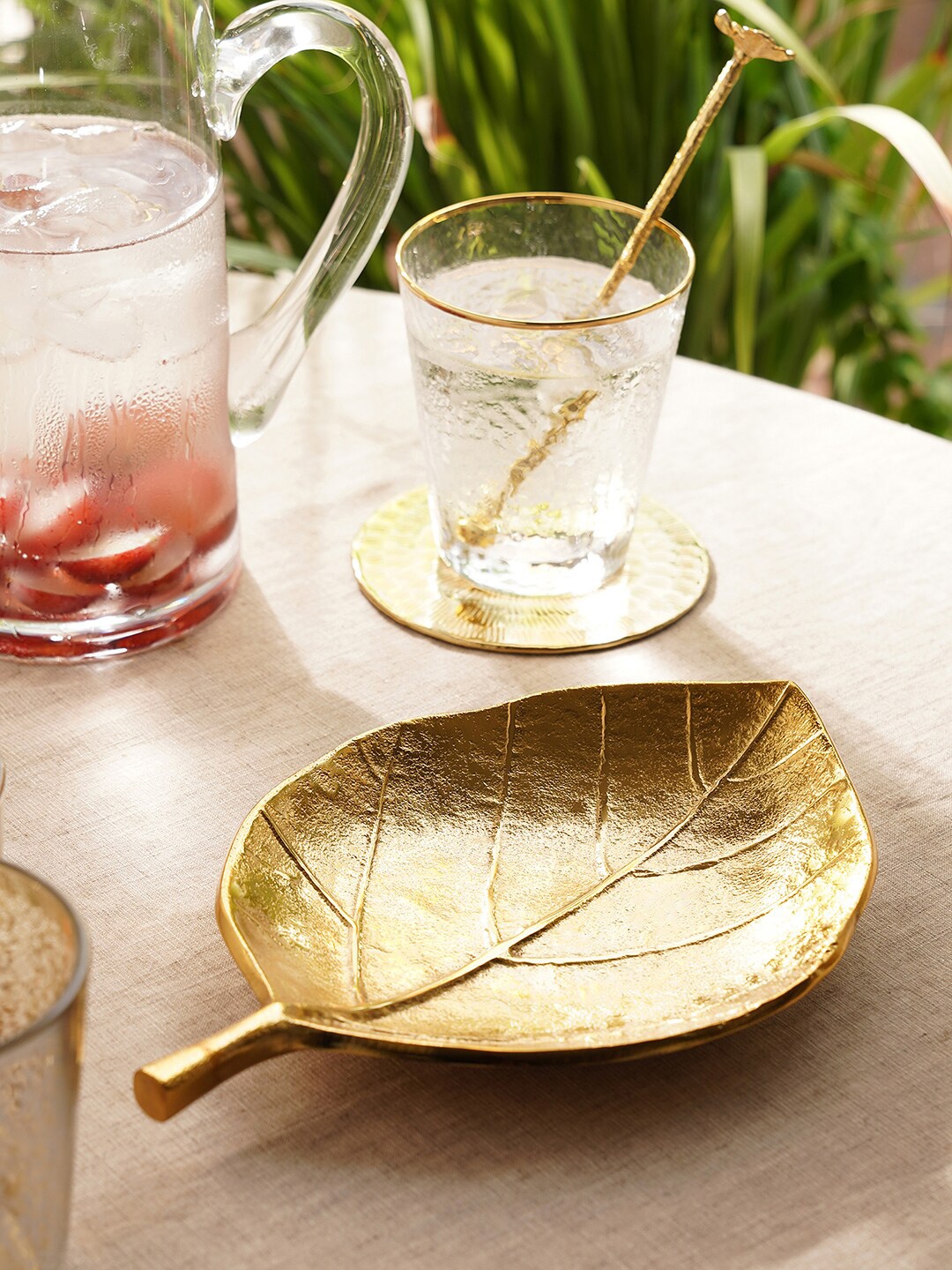 

Pure Home and Living Gold Toned Textured Leaf Metal Figurine Showpiece