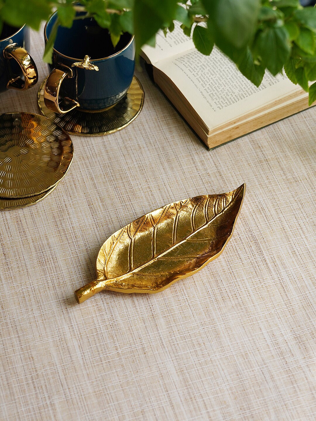 

Pure Home and Living Gold Toned Textured Leaf Metal Figurine Showpiece