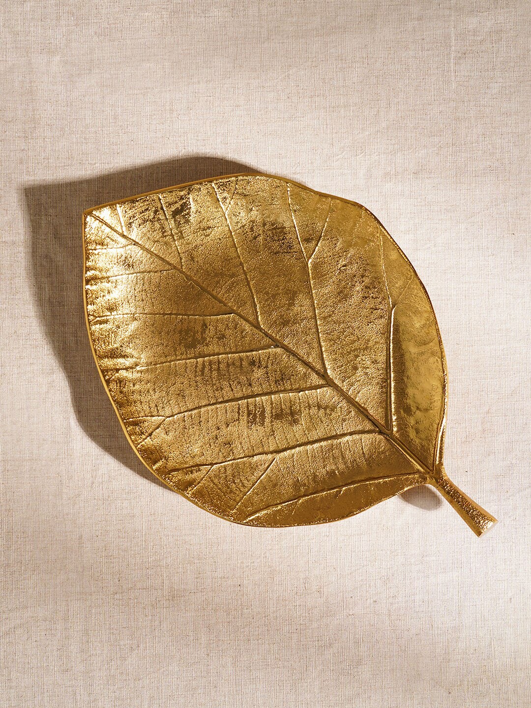 

Pure Home and Living Gold Toned Textured Leaf Metal Figurine Showpiece