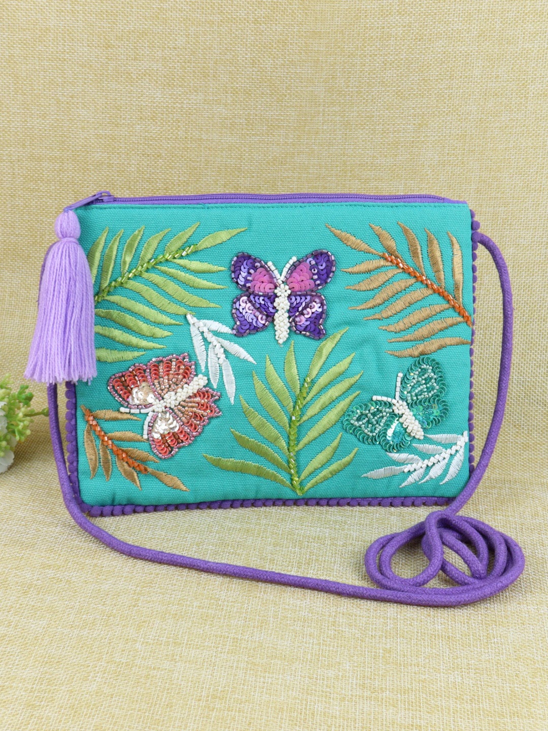 

Asthetika Kids Green Floral Embroidered Tesselled Structured Sling Bag
