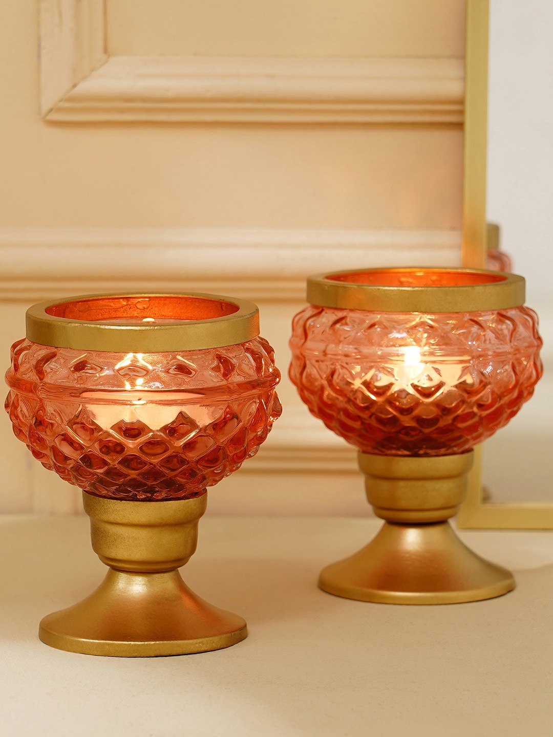 

Home Centre Peach & Brown 2 Pieces Textured Glass Pedestal T-Light Holders