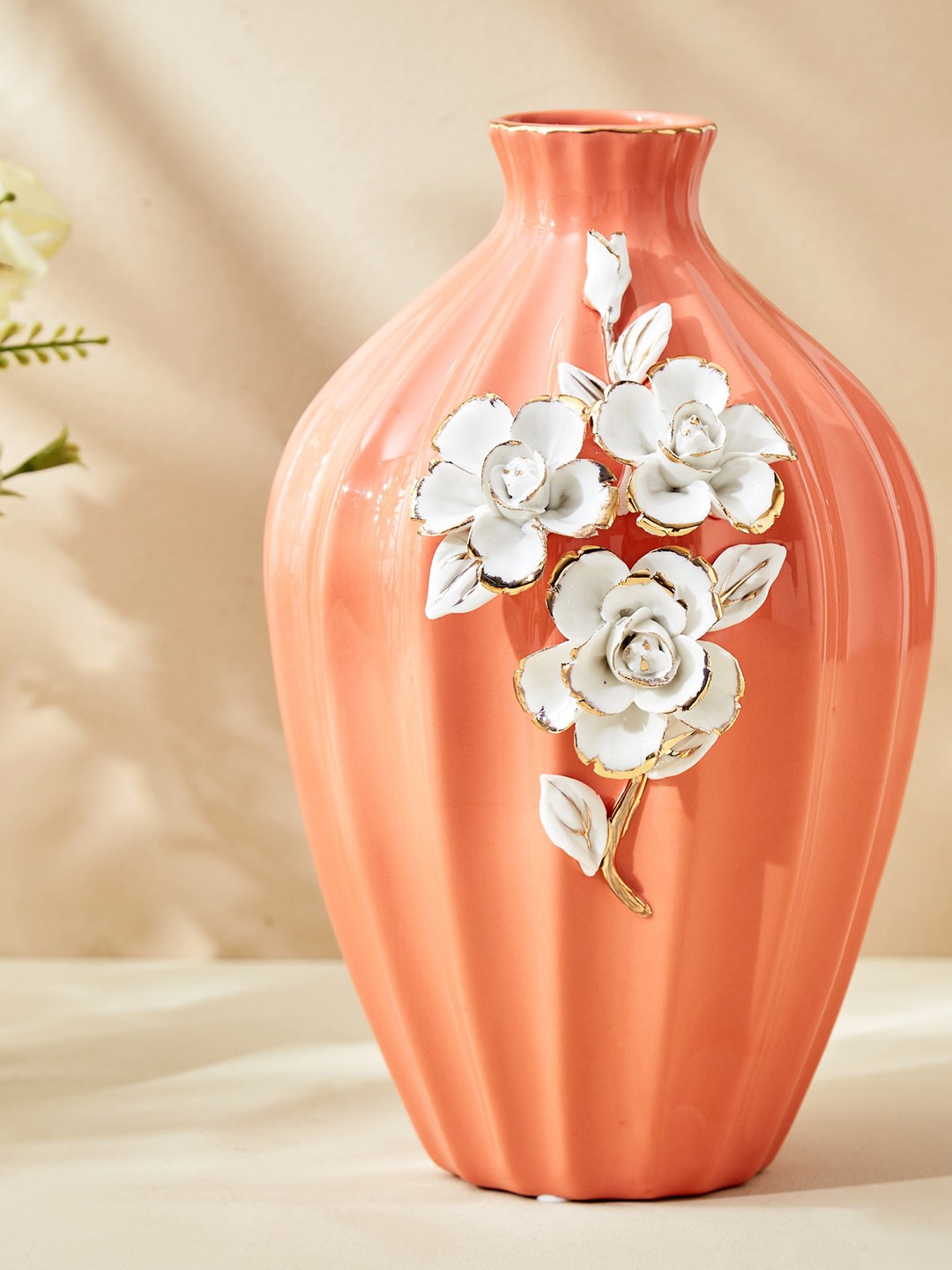 

Home Centre Moksha Peach-Colored Ribbed Polyresin Vase
