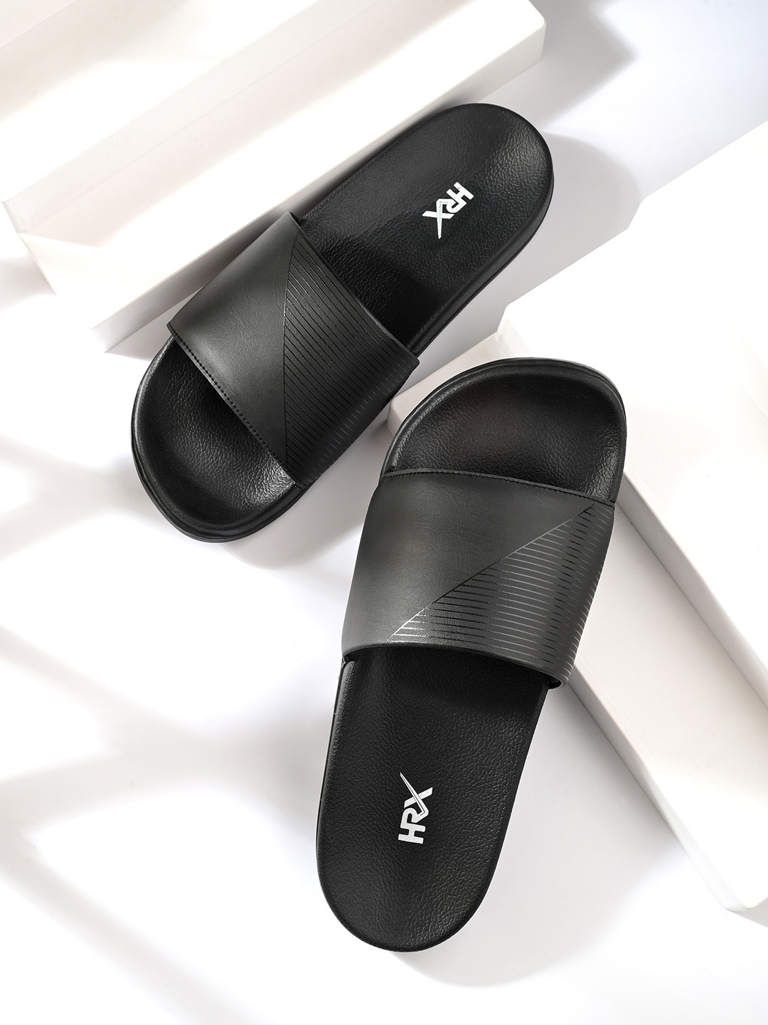 

HRX by Hrithik Roshan Men Black Printed Sliders