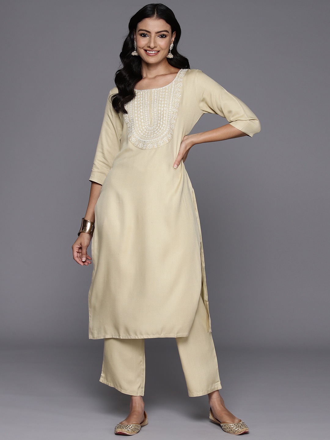 

Libas Women Ethnic Motifs Yoke Design Regular Sequinned Kurta with Trousers, Beige