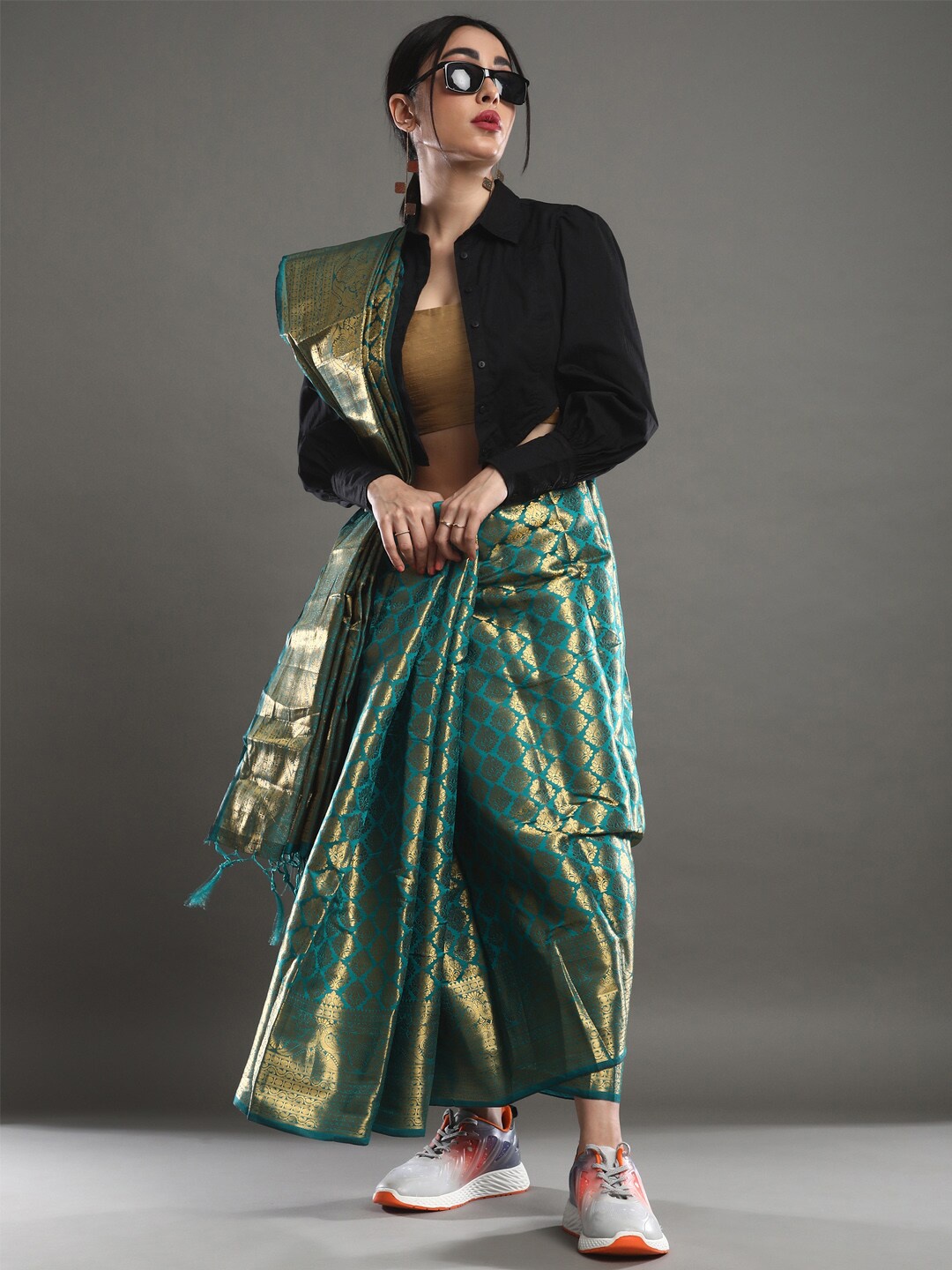 

Mitera Teal & Gold-Toned Ethnic Motifs Woven Design Zari Banarasi Saree