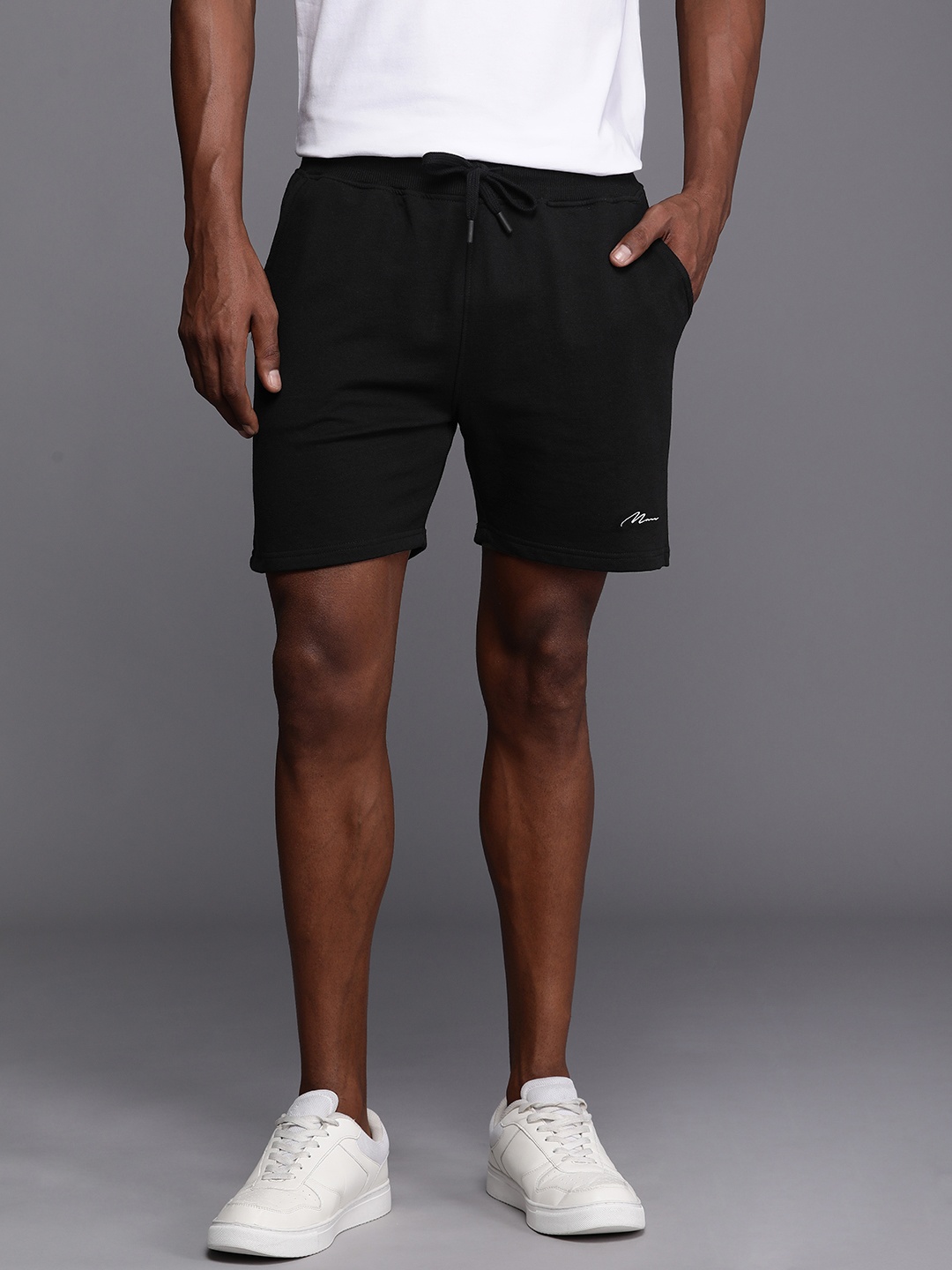 

boohooMAN Men Solid Mid-Rise Regular Shorts, Black