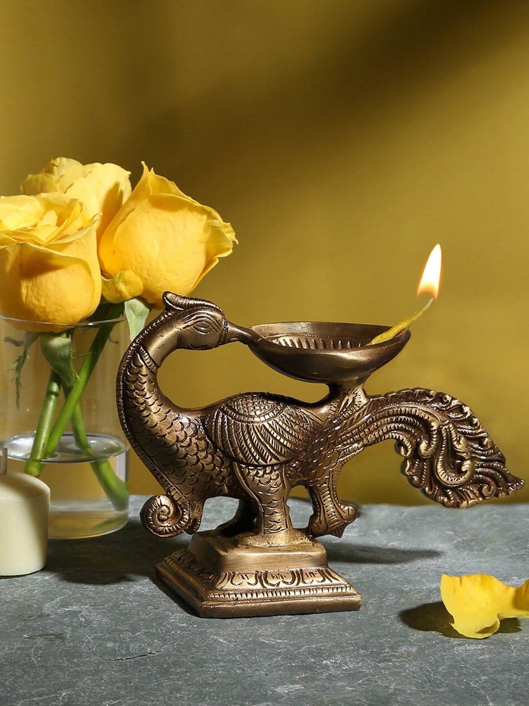 

Two Moustaches Brown Peacock Design Oil Wick Brass Diya