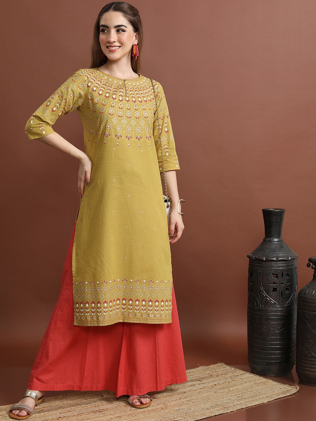 

Vishudh Mustard Yellow Ethnic Motifs Printed Yoke Keyhole Neck Cotton Straight Kurta