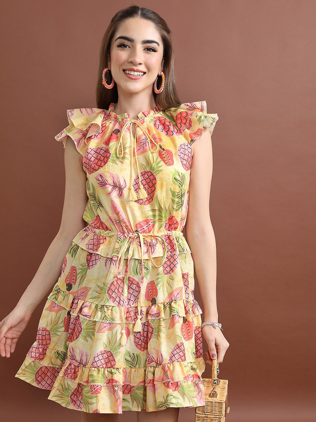 

Vishudh Yellow Tropical Printed Tie-Up Neck Ruffles Detail Fit & Flare Dress