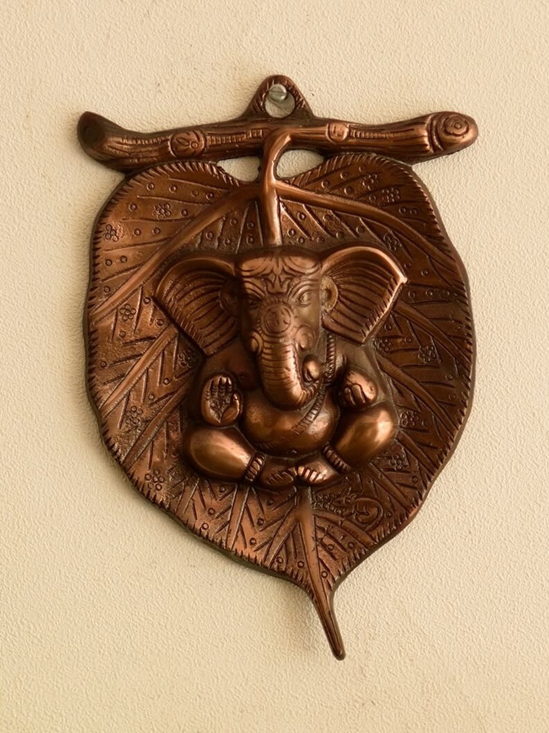 

eCraftIndia Bronze Toned Lord Ganesha on Leaf Wall Hanging
