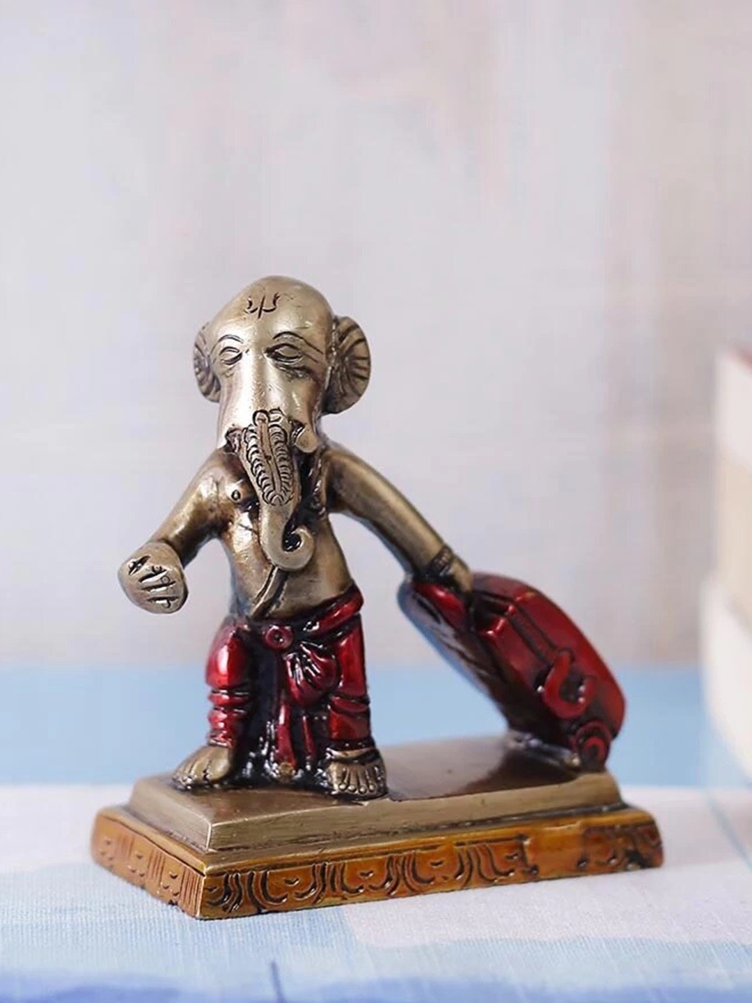 

eCraftIndia Brown Lord Ganesha With Trolley Bag Idol Showpiece