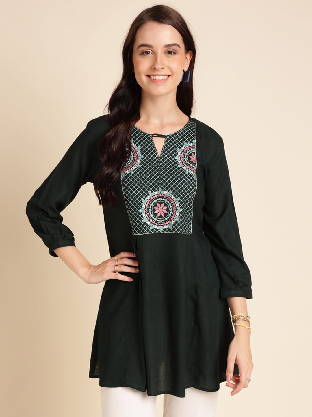 

Sangria Green Ethnic Motifs Yoke Design Thread Work A-Line Kurti