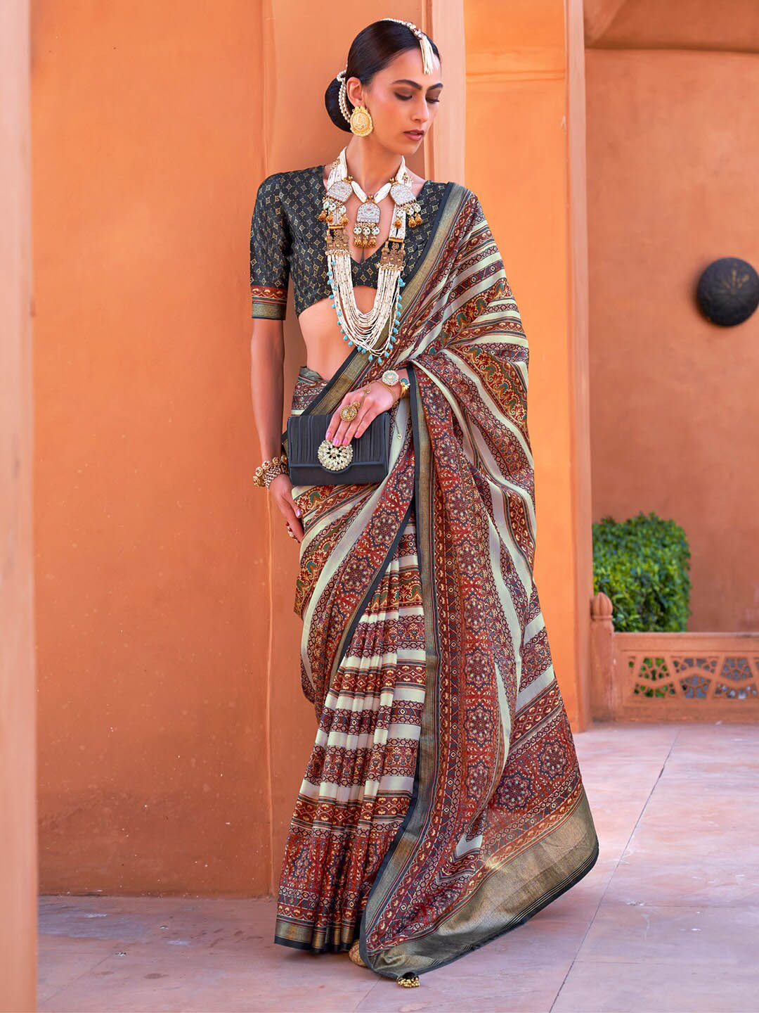 

Anouk Maroon & Cream-Coloured Ethnic Motifs Zari Saree