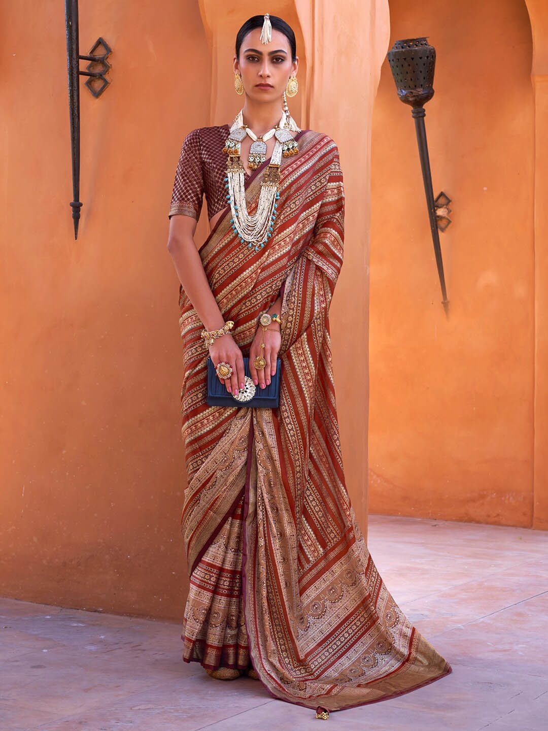 

Anouk Ethnic Motifs Printed Zari Banarasi Saree, Maroon