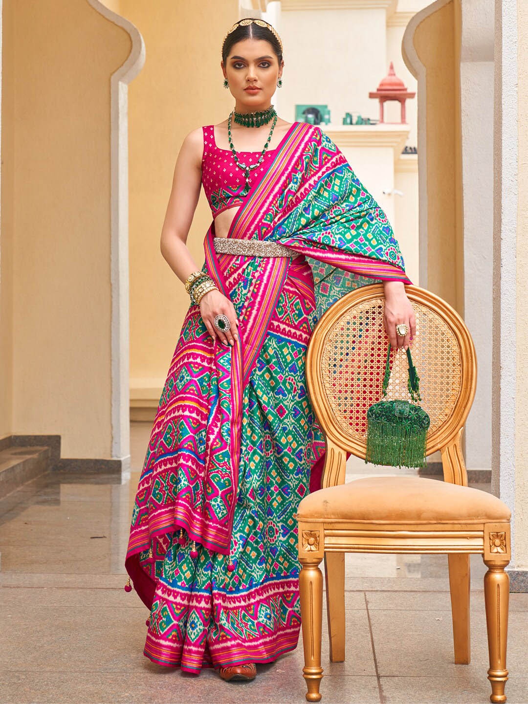 

Anouk Blue & Pink Ethnic Motifs Printed Zari Patola Saree