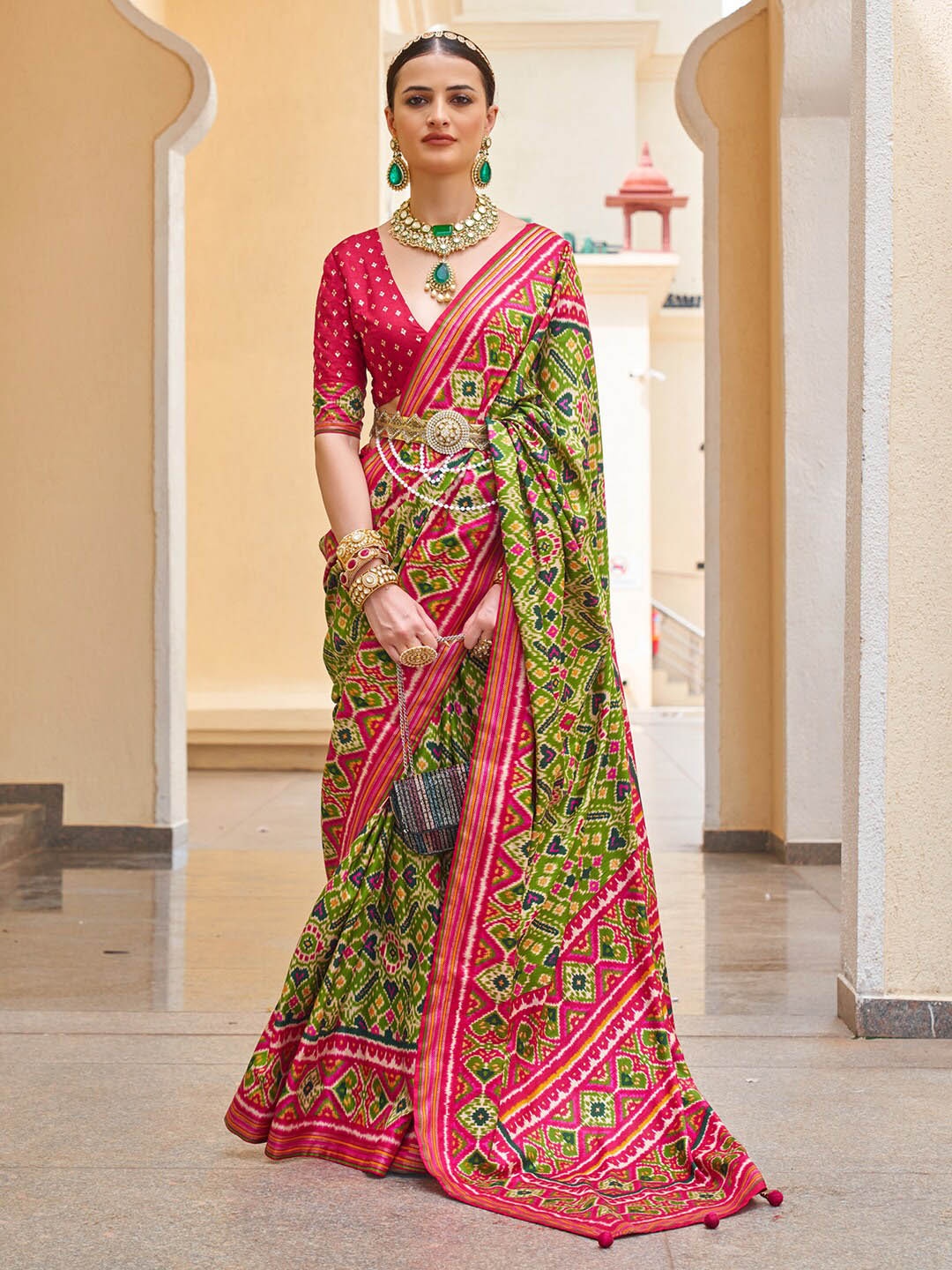 

Anouk Green & Red Ethnic Motifs Printed Zari Patola Saree
