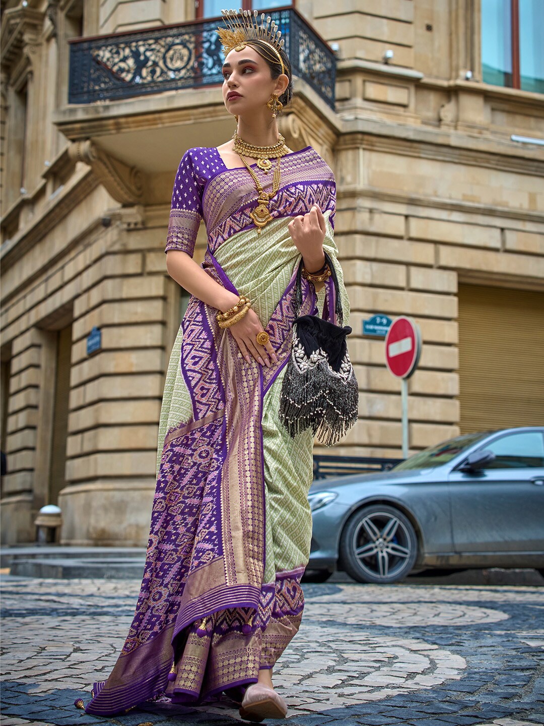 

Anouk Green & Purple Ethnic Motifs Printed Zari Patola Saree