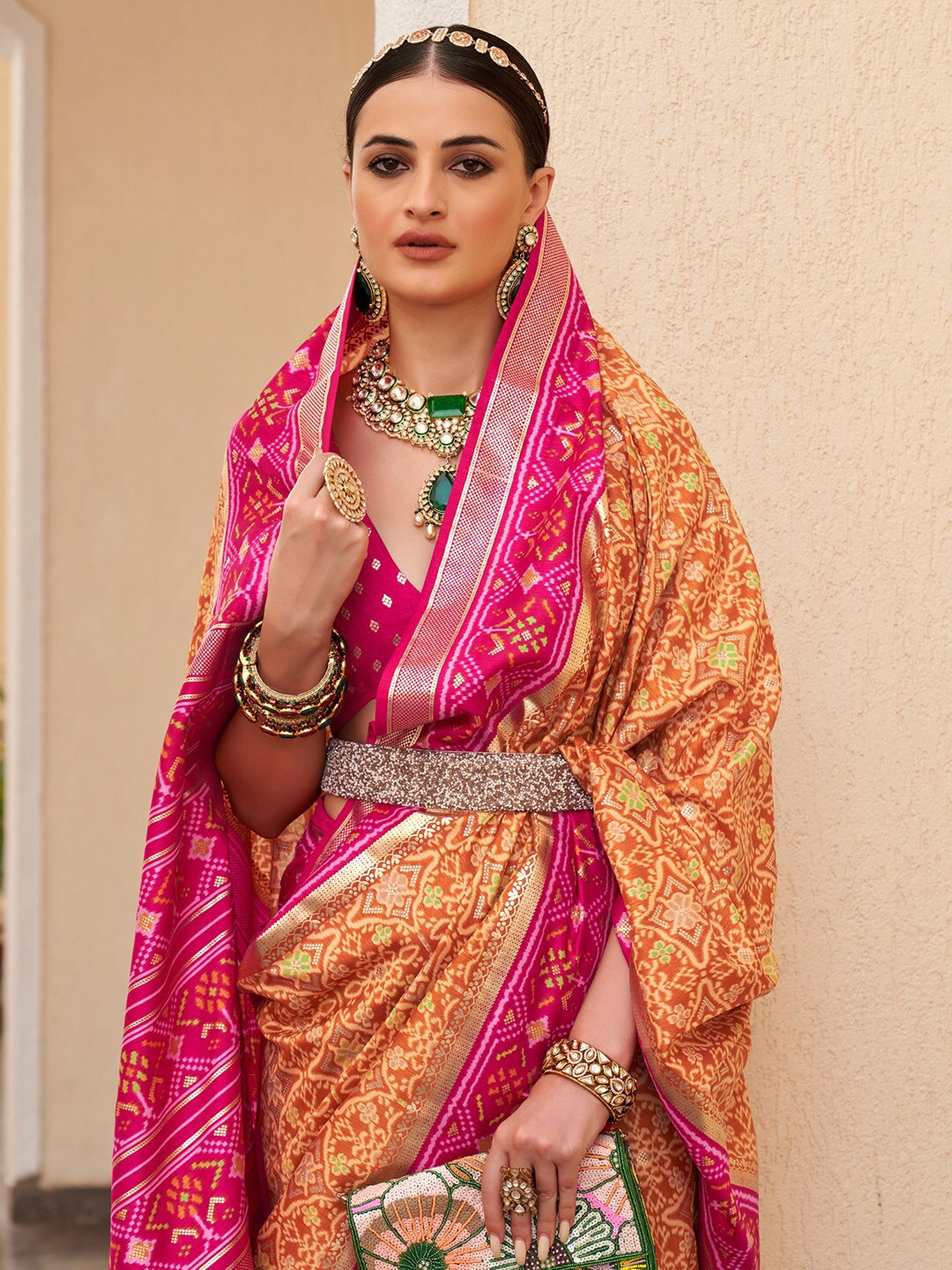 

Anouk Orange & Pink Ethnic Motifs Printed Zari Patola Saree