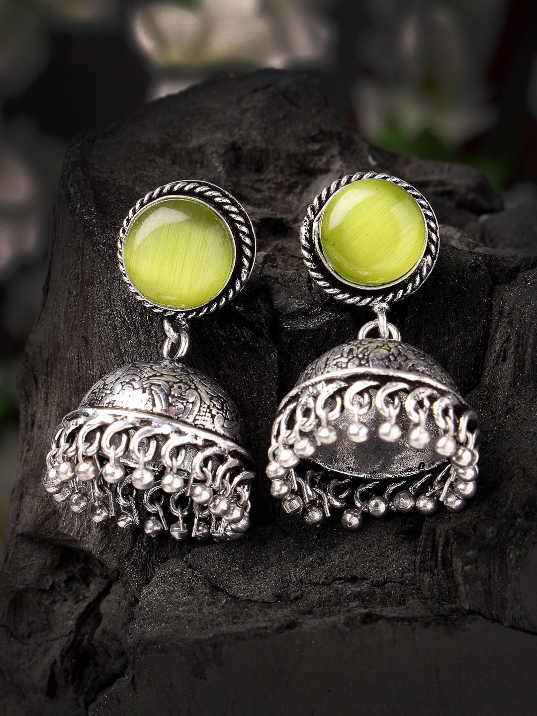 

Sanjog German Silver Oxidized Fluorescent Green Stone Studded Antique Jhumkas