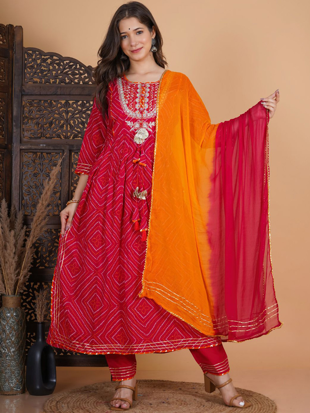 

Karagwals fab Bandhani Printed Gotta Patti Pleated A-Line Kurta With Trousers & Dupatta, Pink