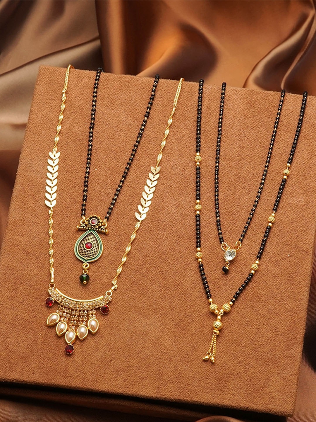 

Ramdev Art Fashion Jwellery Set Of 4 Gold-Plated Stone-Studded & Beaded Mangalsutras