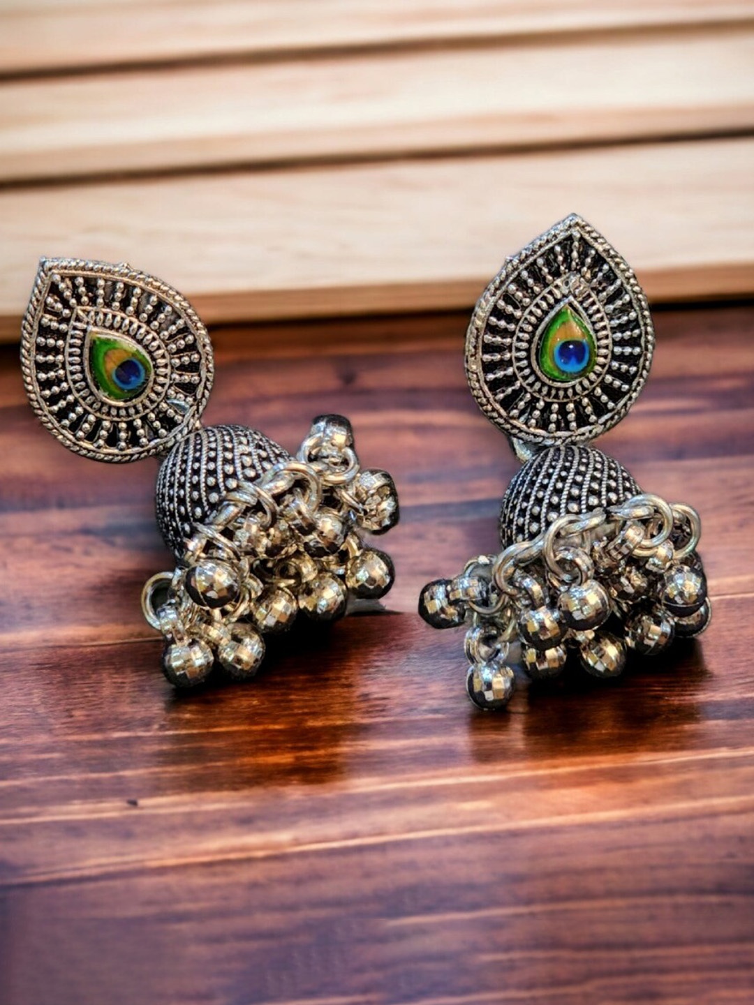 

Goldnera Silver-Plated Paisley Oxidised Shaped Jhumkas