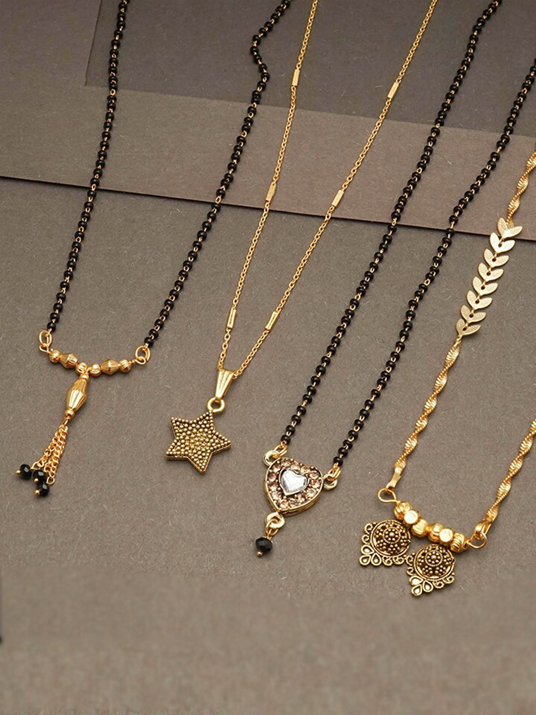 

Ramdev Art Fashion Jwellery Set Of 4 Gold Plated Mangalsutra