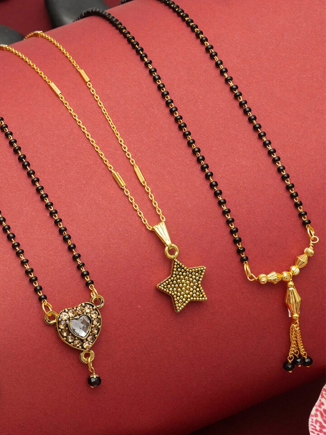 

Ramdev Art Fashion Jwellery Set Of 4 Gold-Plated Stone-Studded & Beaded Mangalsutra