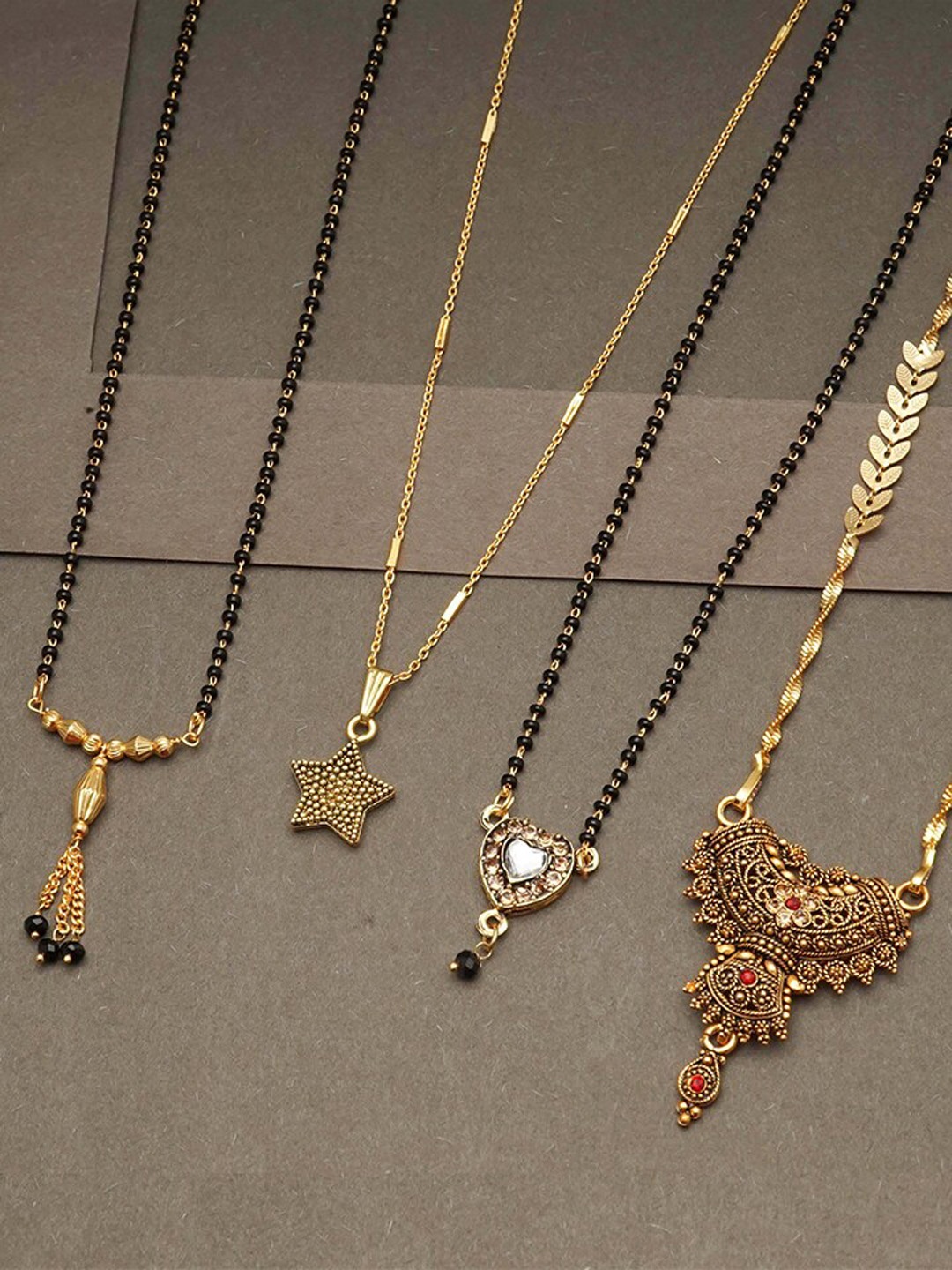

Ramdev Art Fashion Jwellery Set Of 4 Gold Plated Mangalsutra