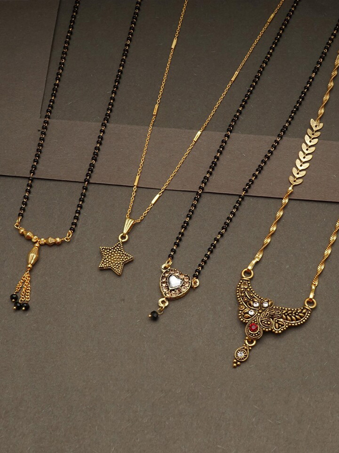 

Ramdev Art Fashion Jwellery Set Of 4 Gold Plated Mangalsutra