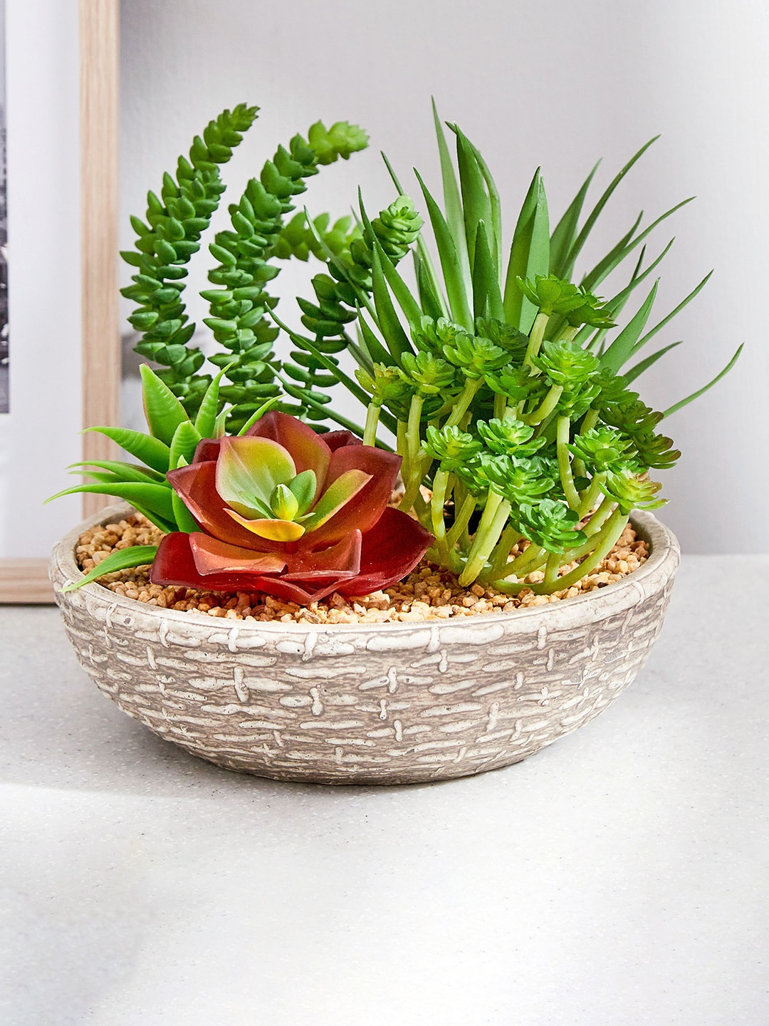 

Home Centre Green & Brown Artificial Flowers With Cement Pot
