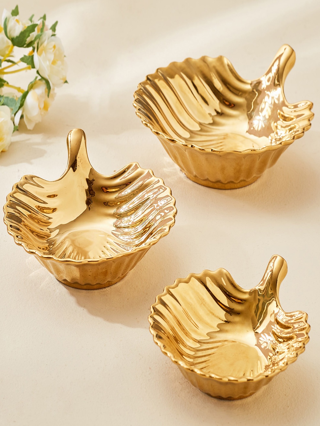 

Home Centre Corsica 3 Pcs Golden Textured Porcelain T-Light Holders, Gold