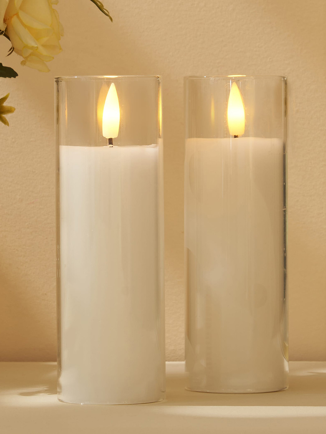 

Home Centre Pegasus 2 Pieces White LED Pillar Candles With Glass