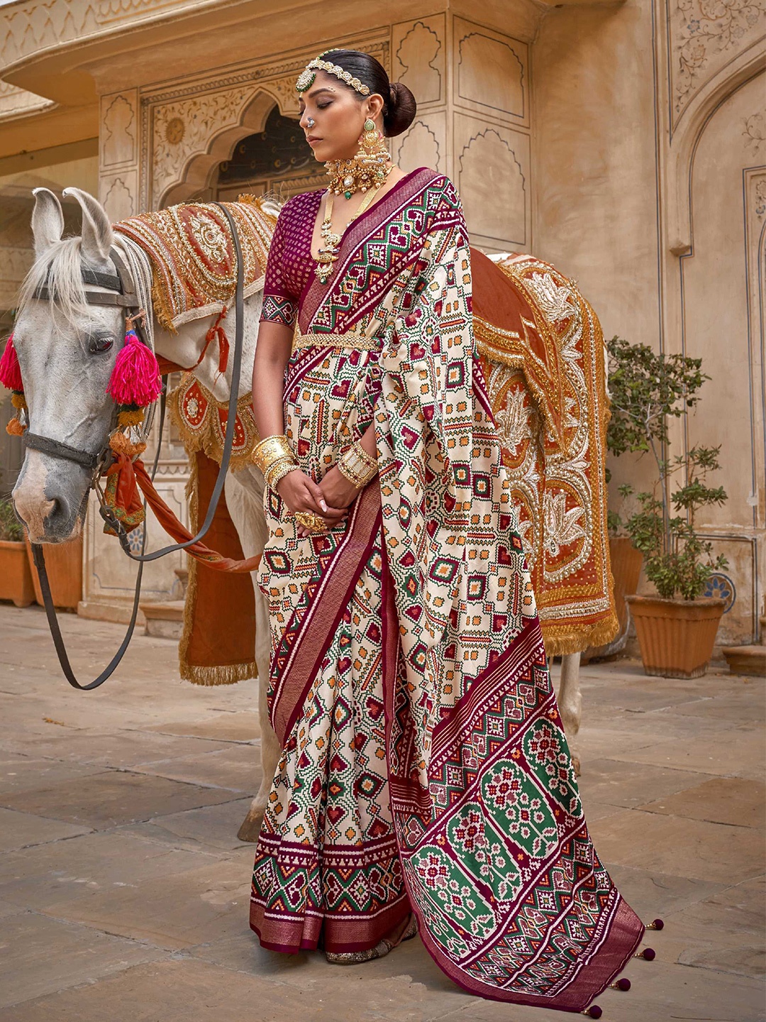 Mitera Purple & Off White Ethnic Motifs Printed Zari Detailed Patola Saree
