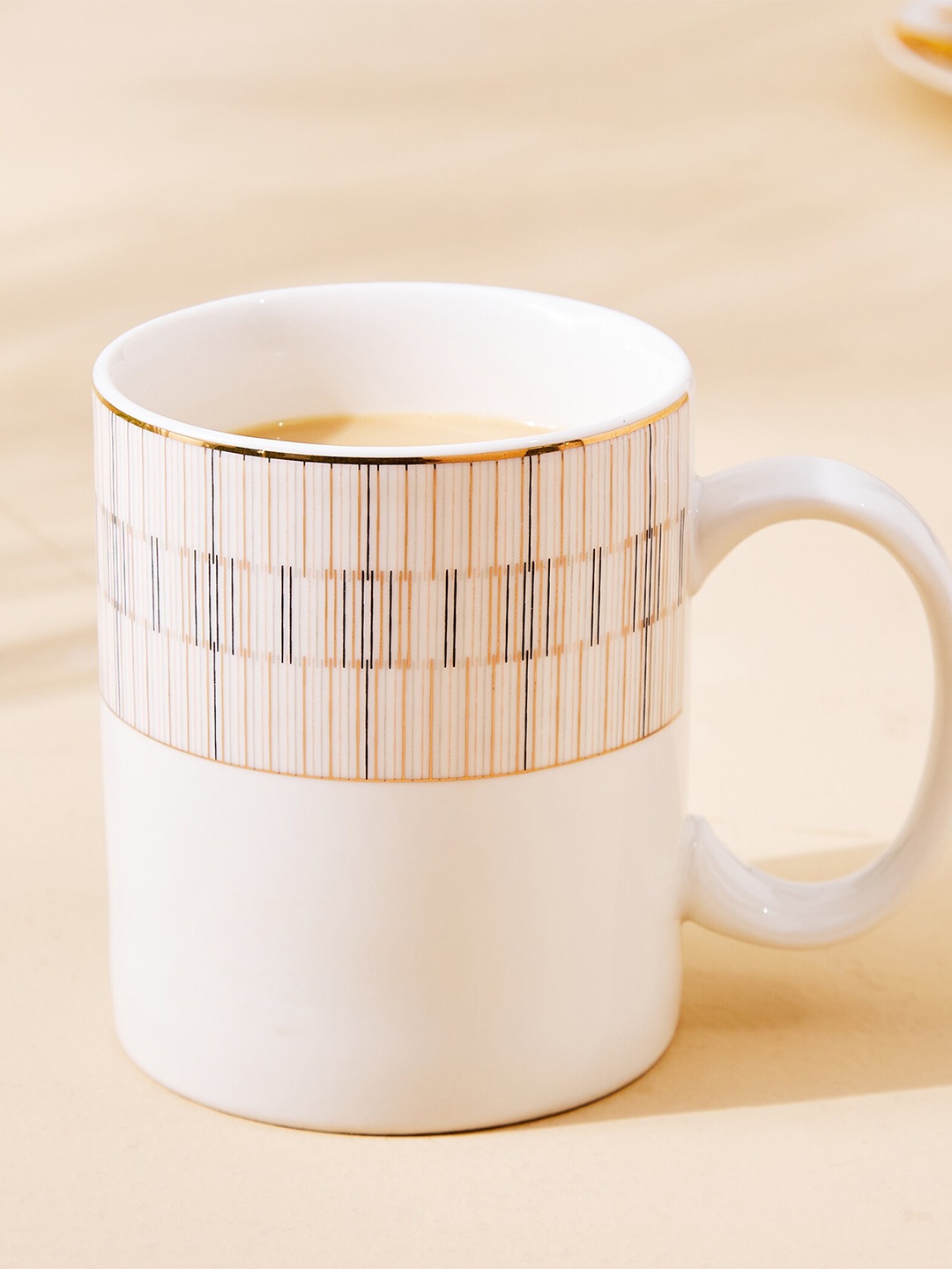 

Home Centre White & Beige Printed Porcelain Glossy Mug 350ml