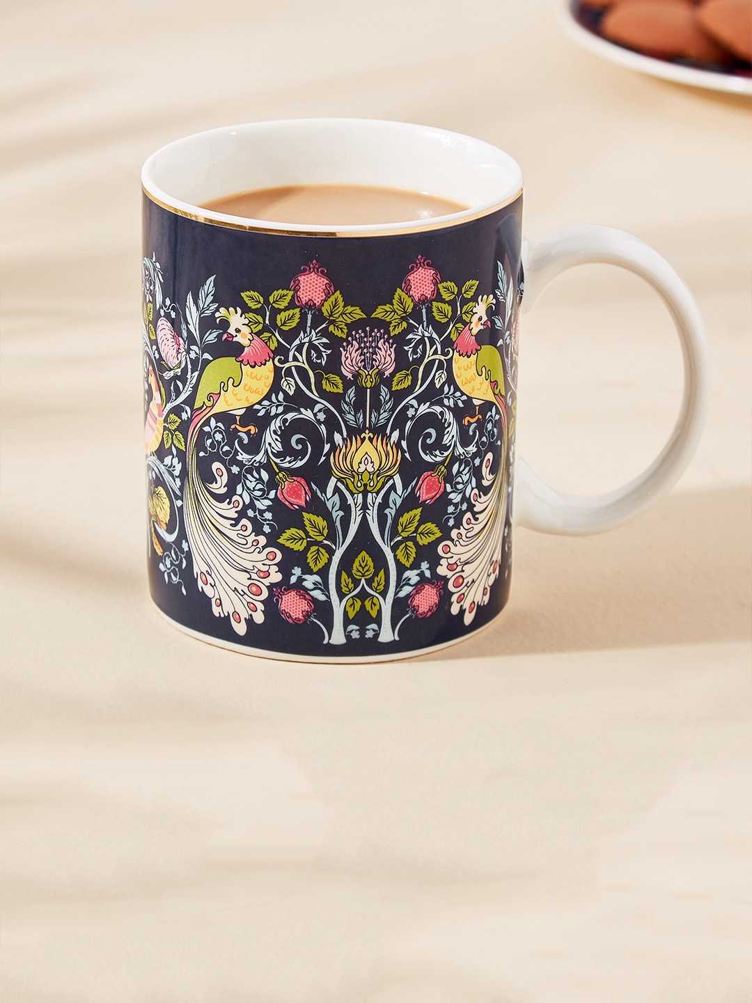 

Home Centre Feslix Morris Blue & Yellow Printed Porcelain Glossy Mug - 340 ML