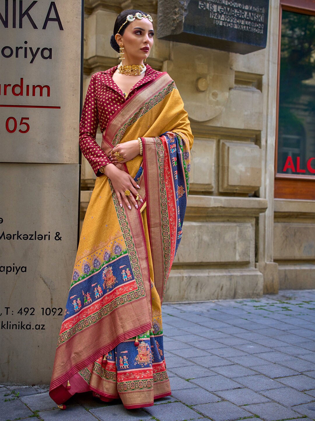 

Saree mall Yellow Ethnic Motifs Printed Zari Detailed Sarees