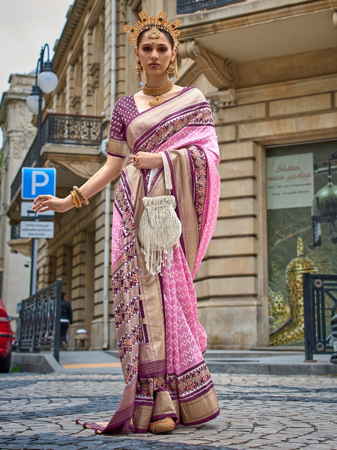 

Saree mall Pink Ethnic Motifs Printed Zari Detailed Patola Saree