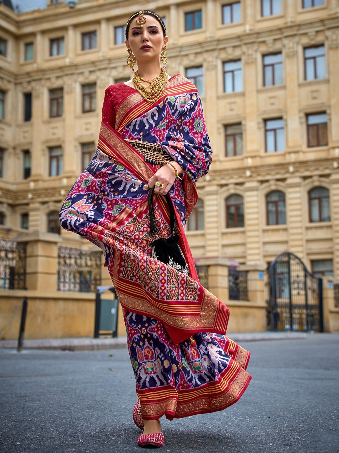 

Saree mall Navy Blue Ethnic Motifs Printed Zari Detailed Patola Saree