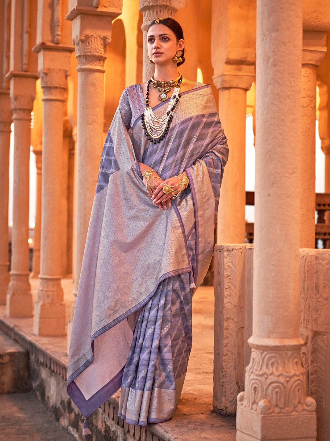 

Saree mall Lavender Ethnic Motifs Printed Zari Detailed Sarees