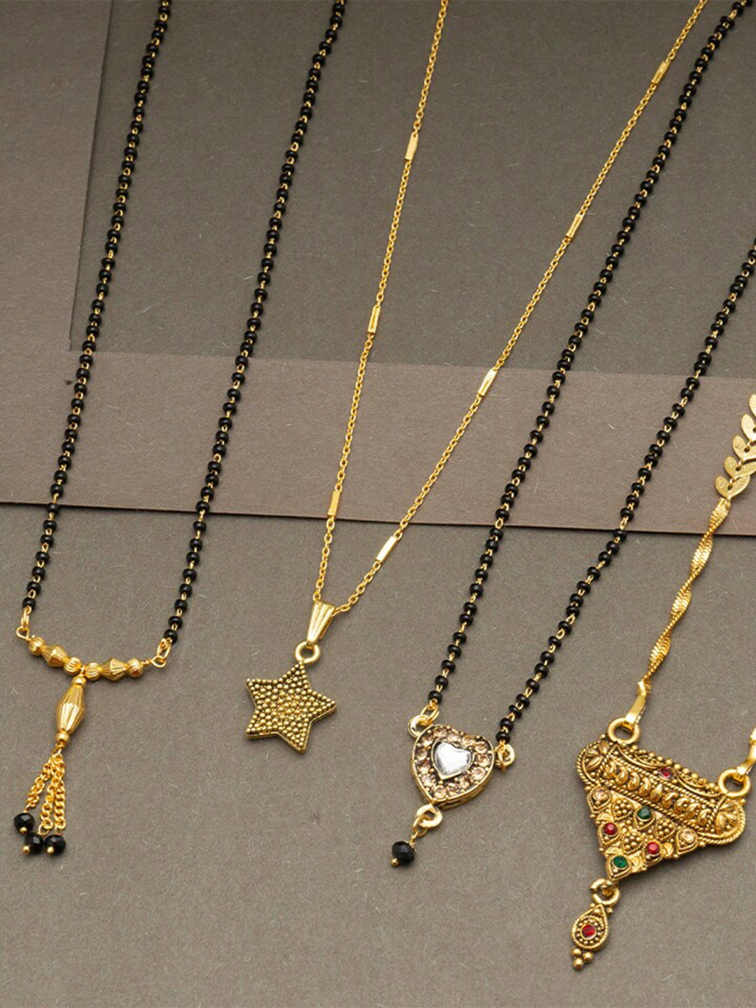 

Ramdev Art Fashion Jwellery Set Of 4 Gold Plated Mangalsutra