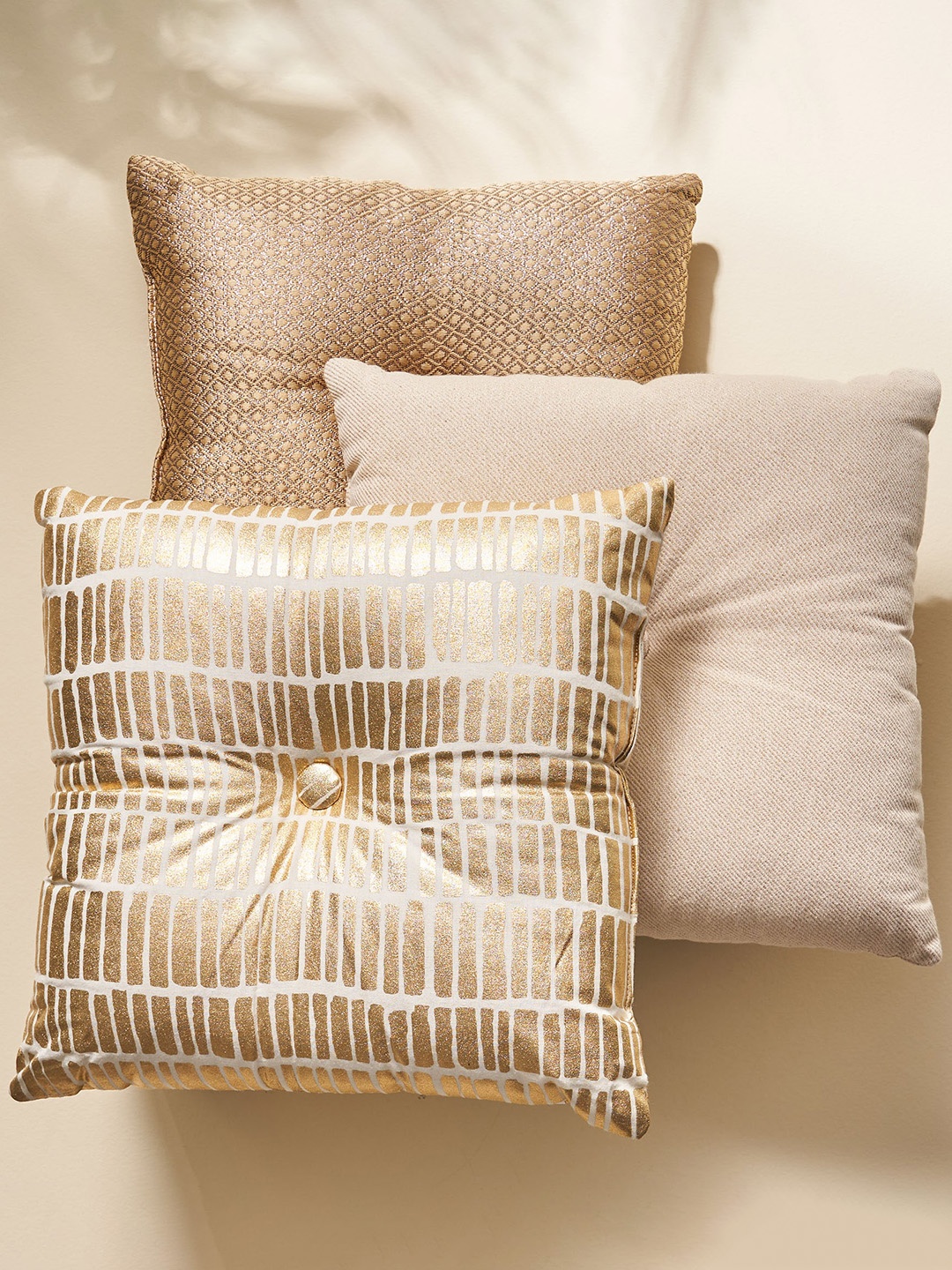 

Home Centre Gold Toned 3 Pieces Filled Cushions