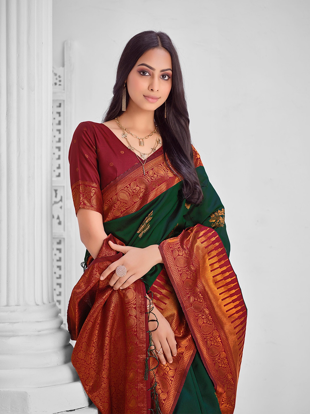 

Sangria Green Ethnic Motifs Woven Design Zari Detail Saree