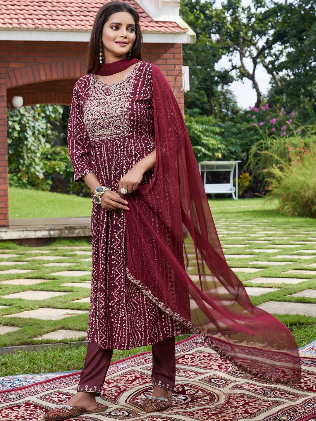 

Indo Era Burgundy Bandhani Printed A-Line Sequinned Kurta With Trousers & Dupatta