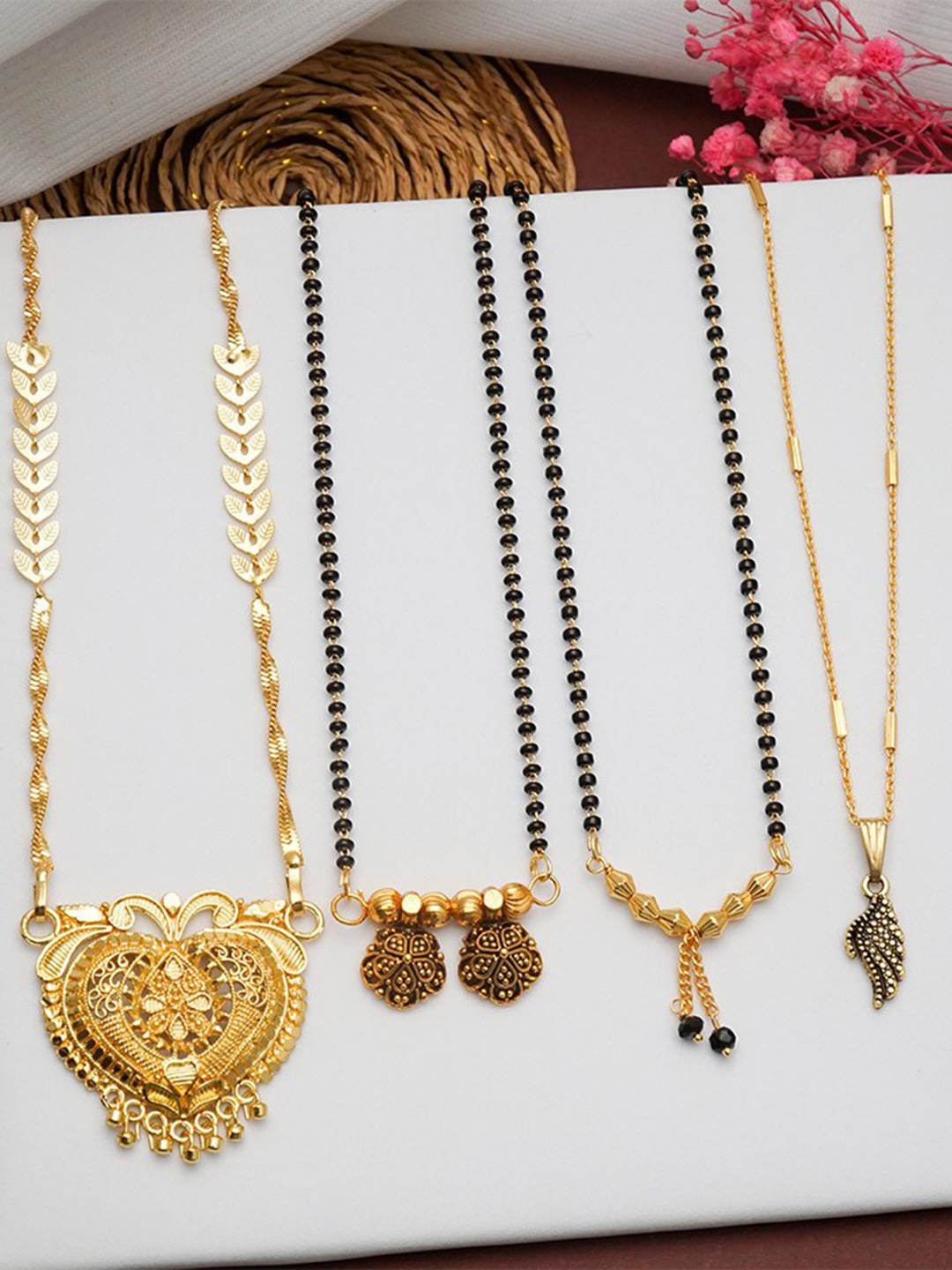 

Ramdev Art Fashion Jwellery Set Of 4 Gold-Plated Stones-Studded & Beaded Mangalsutra
